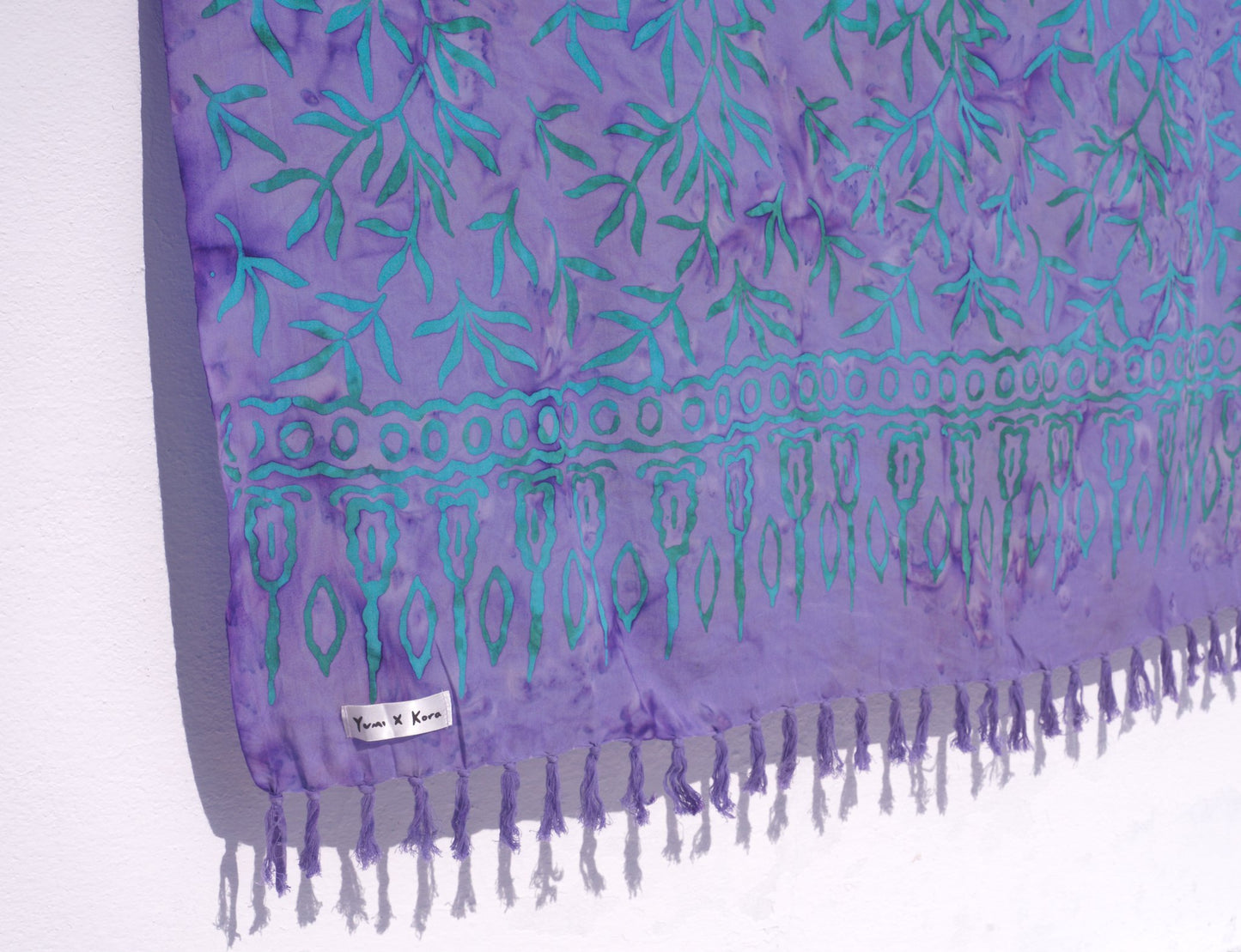 The Lanta Reef - Lavender sarong from YUMI & KORA pattern is shown close up on a white background