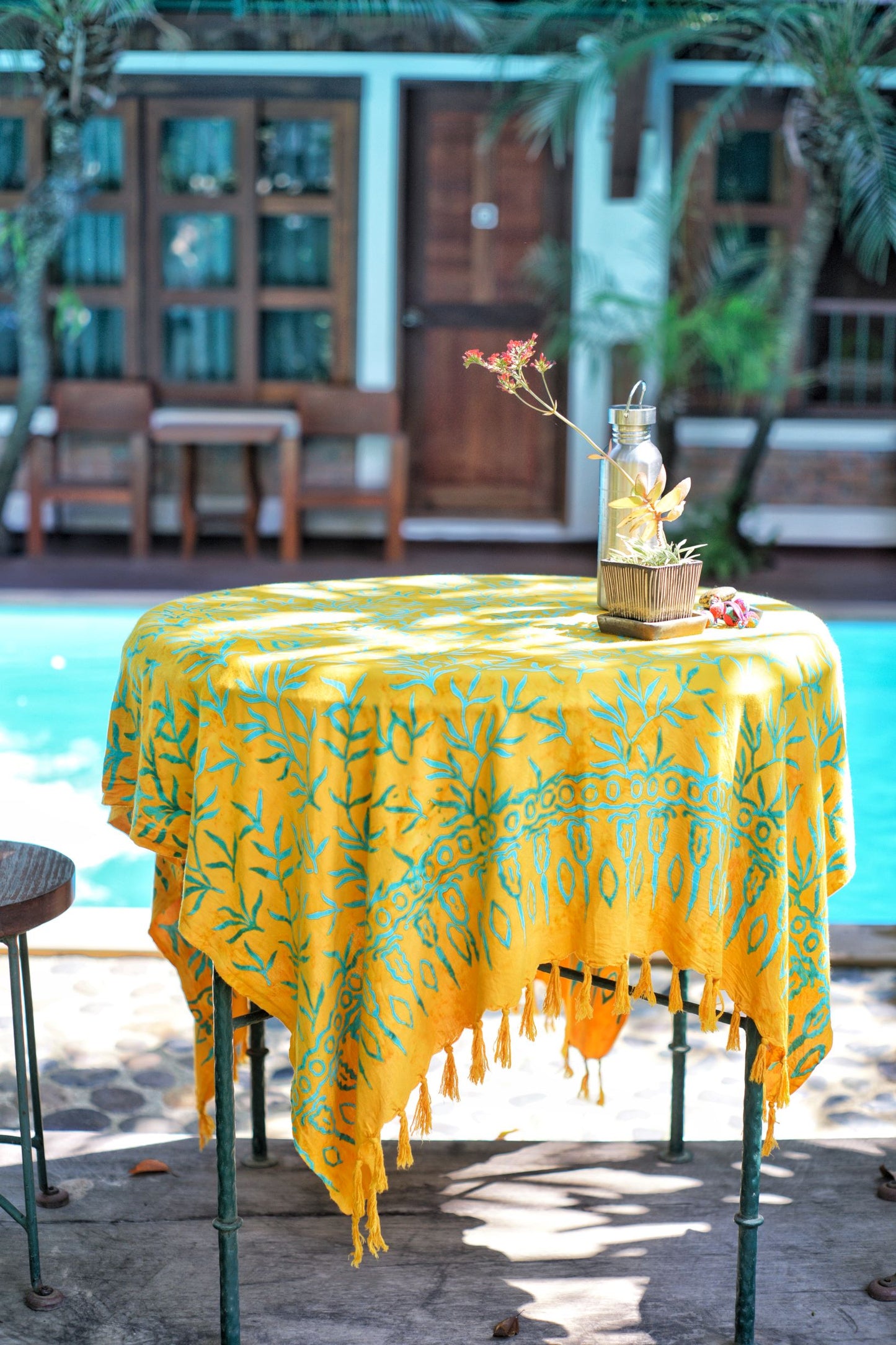 The Lanta Reef - Yellow sarong from YUMI & KORA is used as a tablecloth by the pool