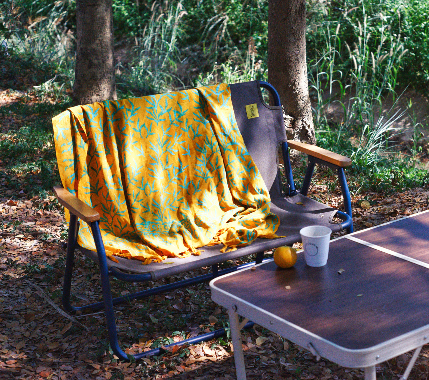 The Lanta Reef - Yellow sarong from YUMI & KORA is draped on a camping chair