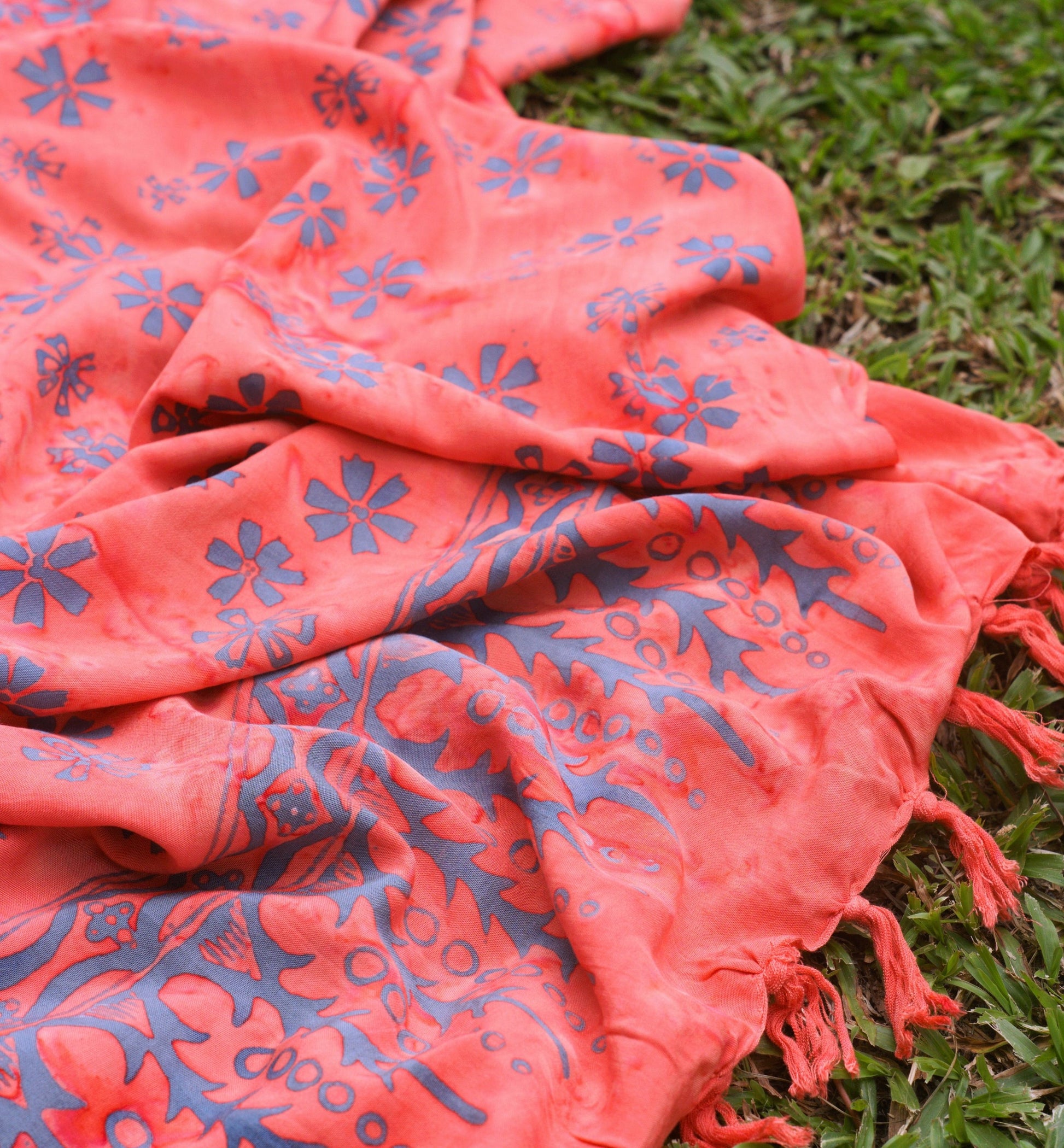 The Sweet Cosmos - Pink sarong from YUMI & KORA is used as a picnic blanket at a grassy park