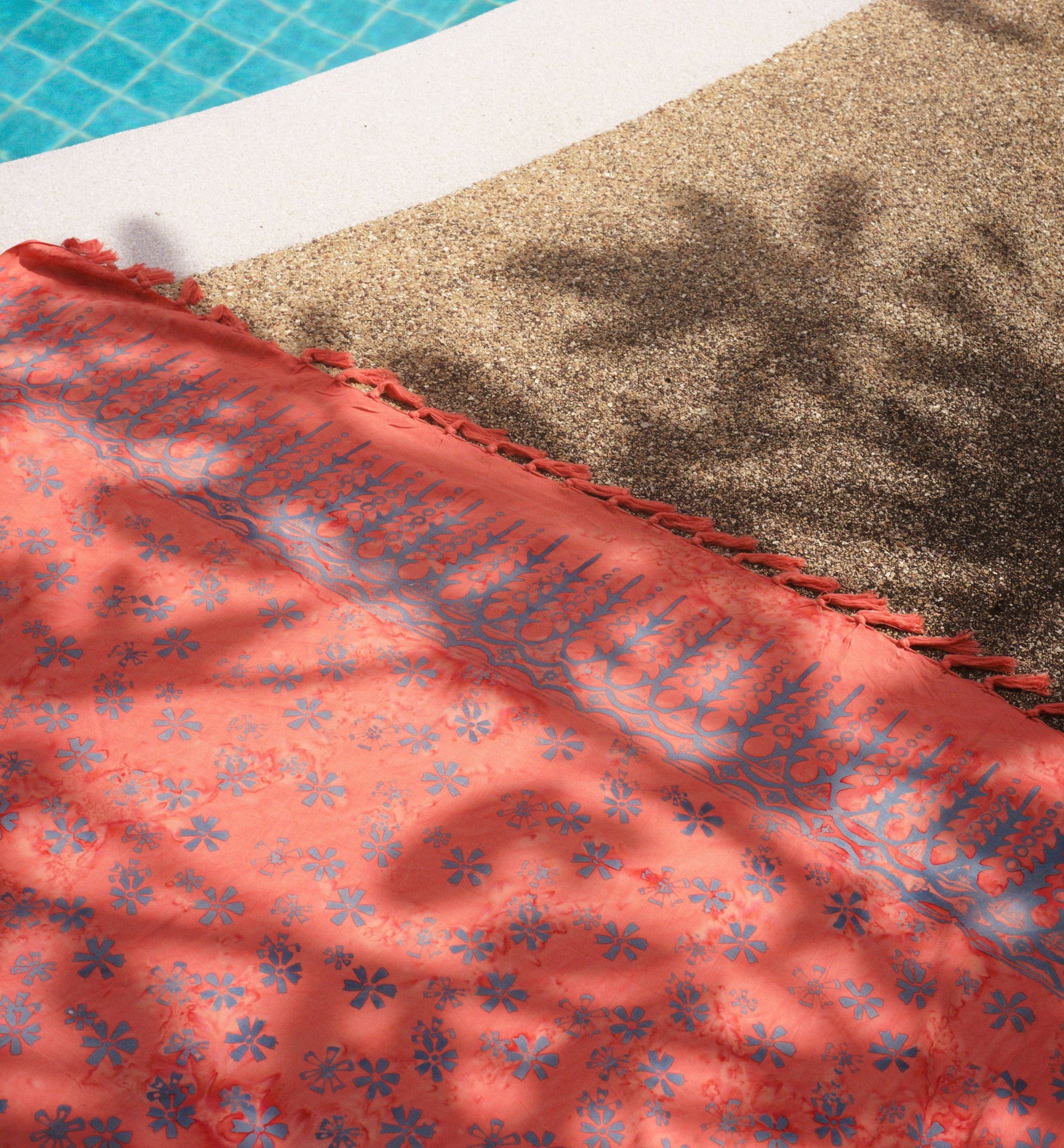 The Sweet Cosmos - Pink sarong from YUMI & KORA is used as a pool towel